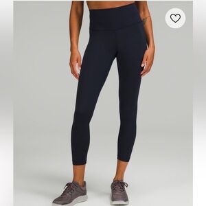 Lululemon wonder under train high rise tight 25” in navy size 8
